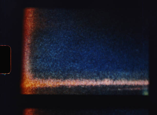 istock Old 8mm film grain creating a textured background with light leaks 2224251977