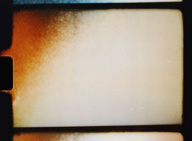 istock Old 8mm film frame showing light leaks and grain creating a textured background 2224254070