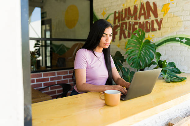 istock Freelancer working on laptop in cozy coffee shop 2224255575