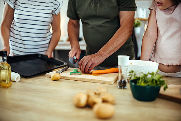 istock Happy family cooking together 2224256799