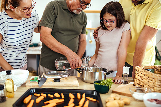 istock Happy family cooking together 2224256917