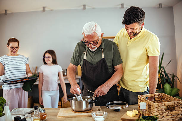 istock Happy family cooking together 2224257077