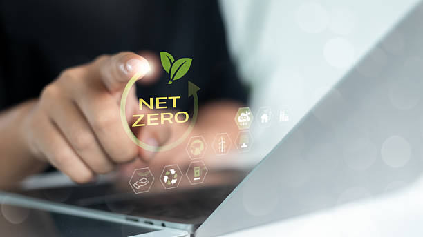 istock Businesswoman using laptop and touching virtual net zero icon for sustainability, green business strategy, and eco-friendly technology innovation in environmental protection. 2224257378