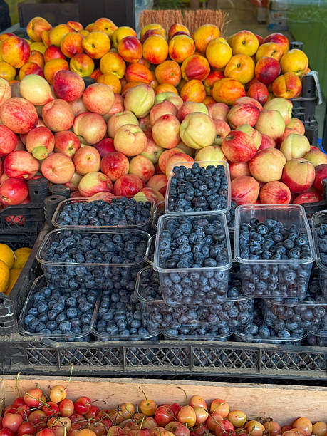 istock Market Display of Fresh Blueberries and peaches 2224258080