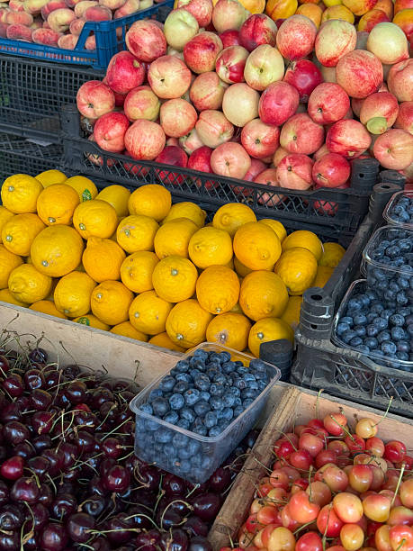 istock Colorful Fruit Market Display with Apples, Lemons, Berries, and Cherries 2224258186