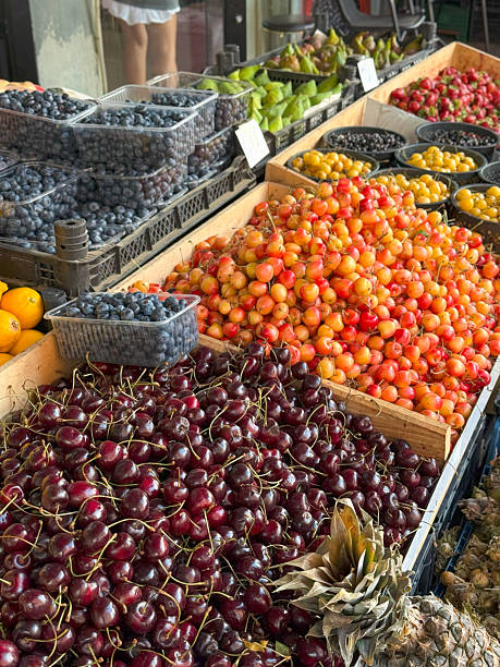 istock Abundant Fruit Market Display with Berries, Pears, and Pineapple 2224259171
