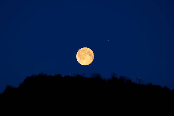 istock Full Moon, stars, planets and landscape scenery silhouettes. 2224260553