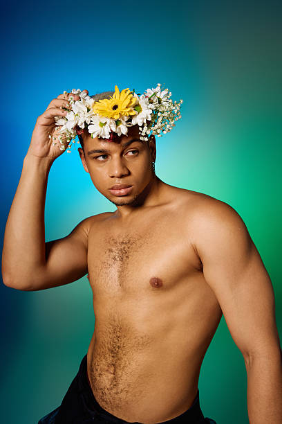 istock Celebrating beauty and diversity with a shirtless young man in a vibrant studio setting 2224262328