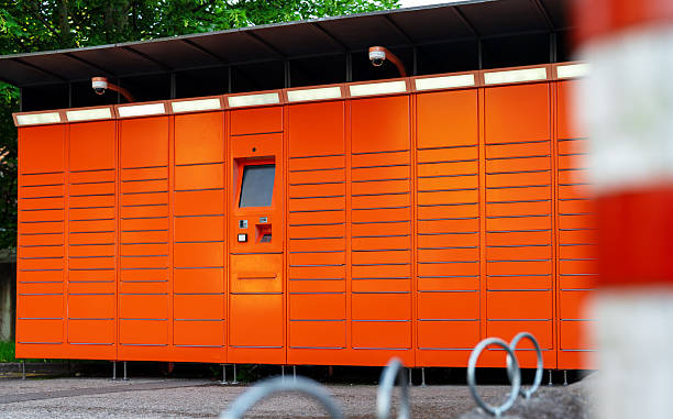 Close-up of orange ticket validation machine at bus station at Swiss City of Zürich on a sunny spring day. Photo taken March 23rd, 2024, Zurich, Switzerland.