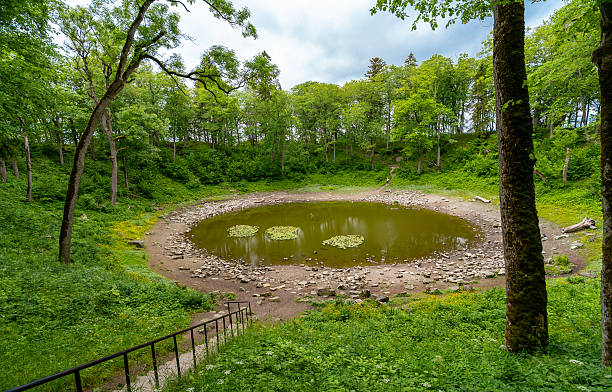 istock Scenic meteorite crater lake Kaali surrounded by forested terrain. 2224265881