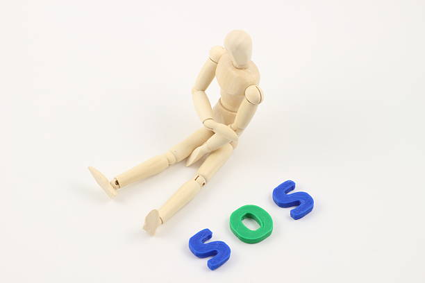 istock SOS Letters Accompanying the Drawing Mannequin. 2224269770