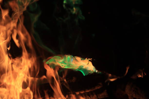 A bonfire with colored flames makes a warm night enjoyable.