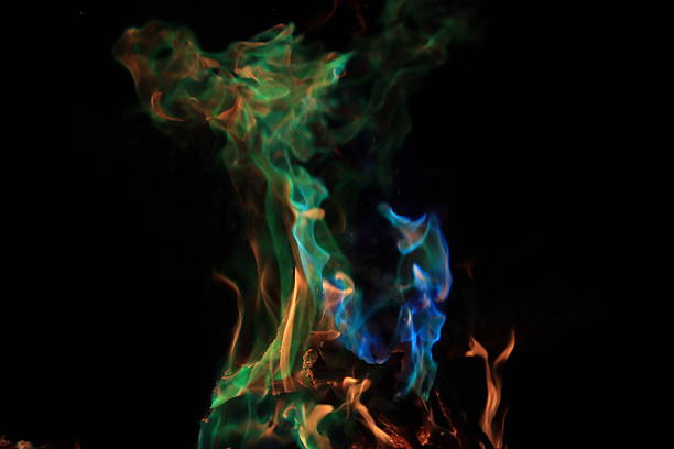 A bonfire with colored flames makes a warm night enjoyable.