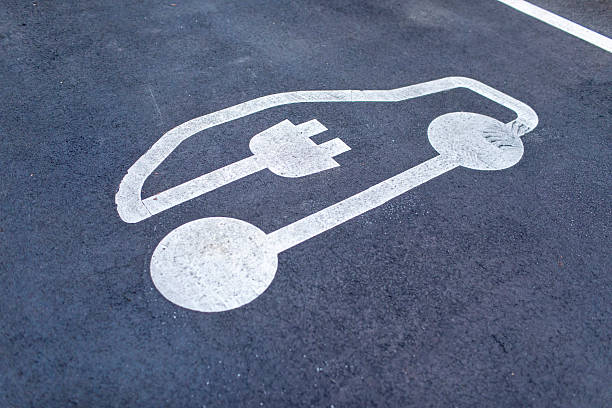 istock Electric vehicle symbol on tarmac 2224270851