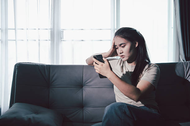 istock Sorrowful woman sat alone, overwhelmed by emotion, her sad and unhappy expression revealing deep despair, stress and distress left feeling depressed. sorrowful sad, despair alone, depressed stress 2224273496