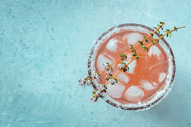 istock Salty Dog cocktail with fresh grapefruit juice, lime juice, and thyme 2224274335