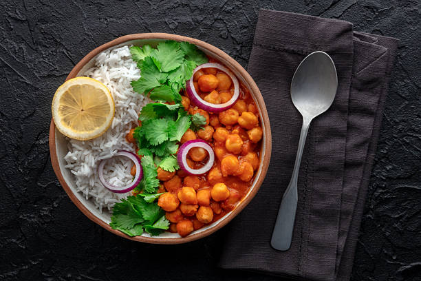 istock Chana masala, chickpea curry, traditional Indian dish, overhead flat lay shot 2224274440