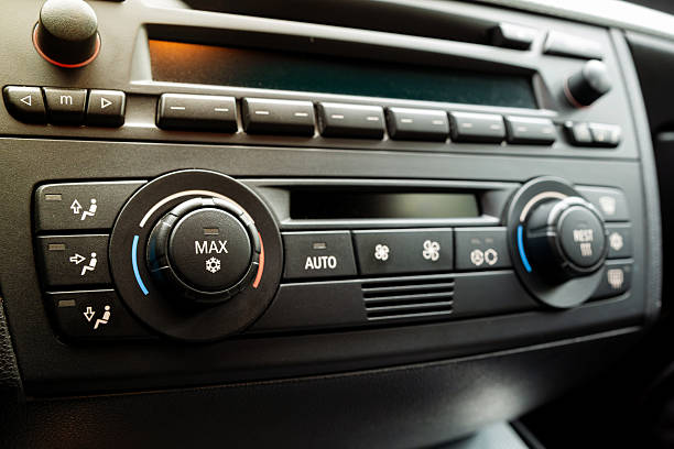 istock Car dashboard AC control panel with physical button and small LCD. Close up, detail show, snowflake pictogram to denote air conditioning, no people 2224275457