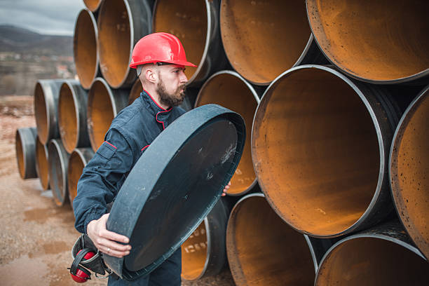 istock Focused engineer removes the cap from the gas pipe 2224275509