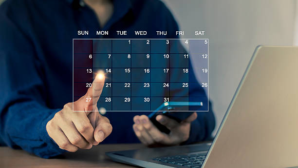 istock Person interacting with a digital calendar on an appointment planning screen 2224276215