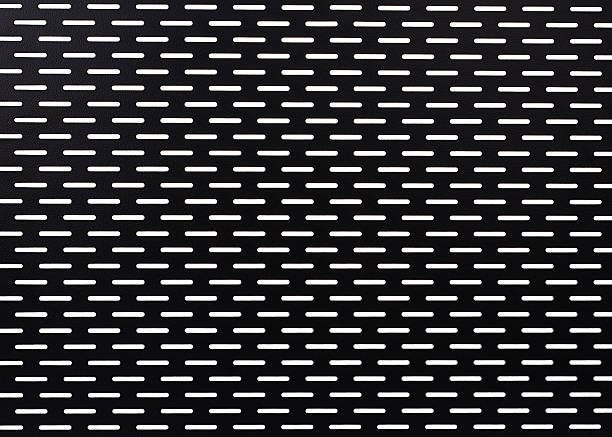 istock Black perforated metal panel featuring symmetrical horizontal slots in an industrial design pattern 2224279185