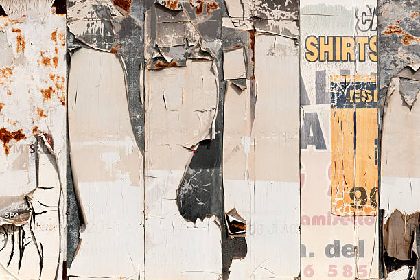 Torn and peeled street poster background, weathered old paper backdrop
