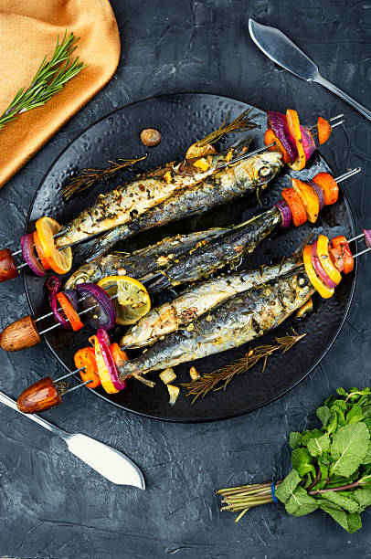 istock Fish and vegetable skewer in barbecue grill. 2224281464