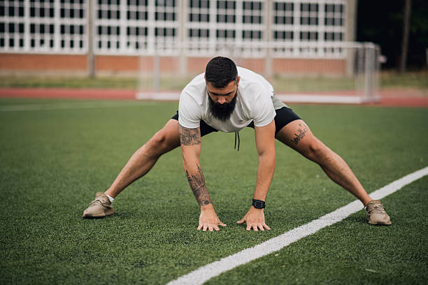 istock Tattooed Athlete Doing Exercises Outdoors 2224282486