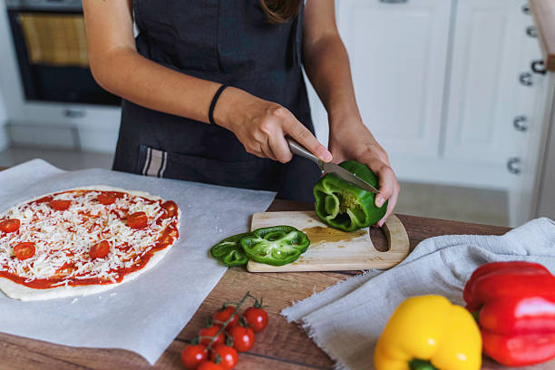 Slicing Fresh Green Bell Pepper for Pizza Toppings