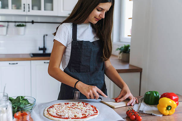 istock Creating Pizza with Fresh Ingredients and Care 2224284220