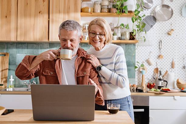 istock Middle-Aged Couple Using Laptop While Having Coffee in the morning 2224289008