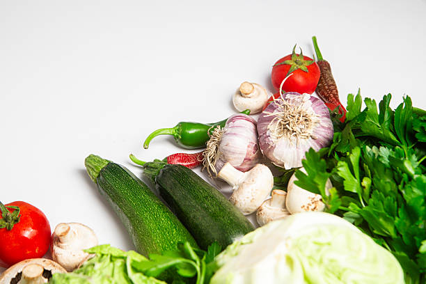 Fresh vegetable assortment on White Background, healthy eating concept.