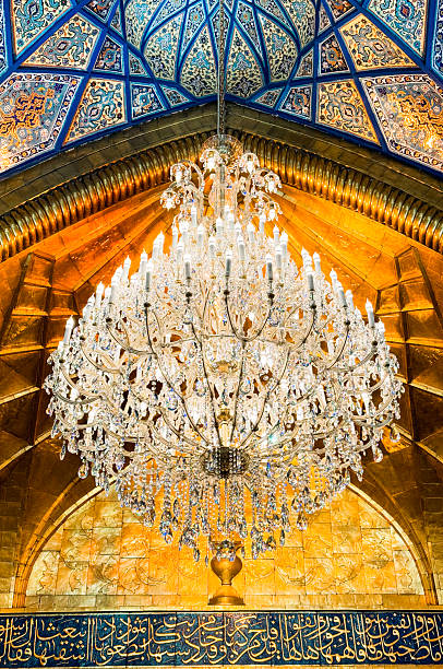 istock Intricate chandelier beneath colorful ceiling in Karbala Iraq 2224292899