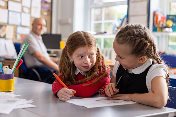 istock School Girls Chatting in Class 2224293875