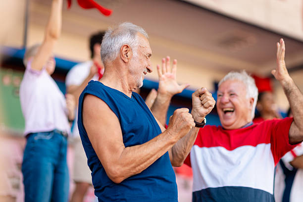 istock Supporters celebrate victory with excitement at a packed sports event while cheering for their team in a vibrant stadium 2224296154