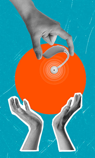 istock Technology is shared between hands in a demonstration of hearing aid innovation 2224296232