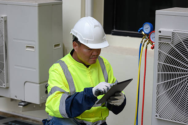 istock Technicians are checking the cooling system of the outdoor air conditioner. 2224297057