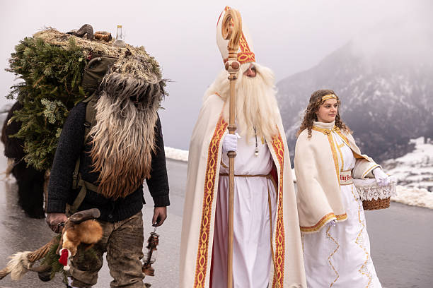 istock Festive procession in the mountains features traditional figures during winter celebration 2224297766