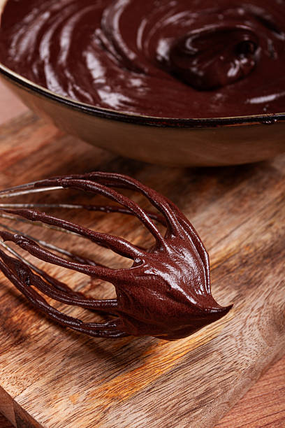 metal whisk, close-up with chocolate dough , baking, structure and consistency, homemade, top view, no people,