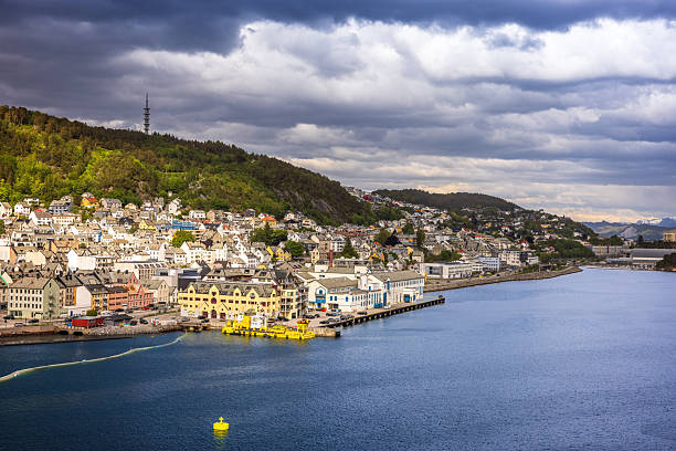 Alesund is a port town on the west coast of Norway, at the entrance to the Geirangerfjord. Panoramic views of Alesund architecture, the surrounding archipelago and fjords from Mount Aksla lookout