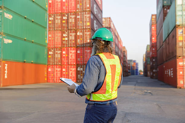 istock Businessmen and engineers inspect containers for export by global businesses. 2224301005