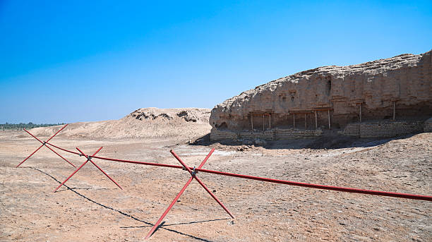 Excavation at Kish Archaeological Site in Iraq under clear blue sky