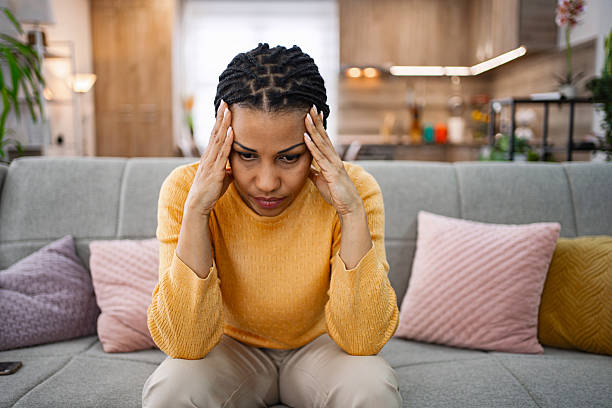 istock Stressed Young Woman Suffering From Headache at Home 2224306578