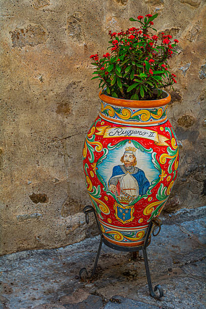 Narrow streets and Stairways with ceramic pots in Cefalu, Sicily, Italy