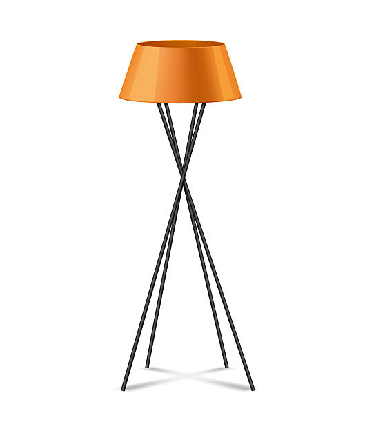 istock Modern Orange Tripod Floor Lamp with a Minimalist Design and Sleek Black Legs 2224308770