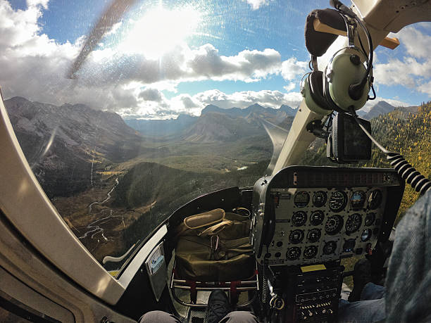 istock Helicopter cockpit flying over scenic mountain valley in autumn 2224309639