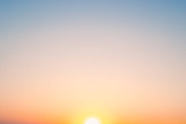 The sunset sky gradient transitions from deep orange to soft blue, capturing a moment of natural beauty.