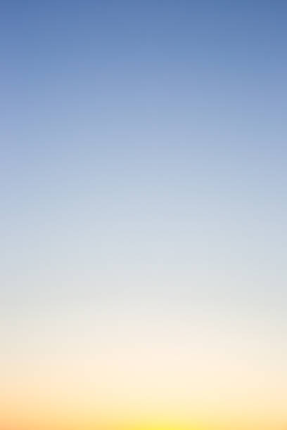 istock A clear, gradient sky transitions from pale blue at the top to soft yellow at the bottom, creating a serene and minimalist backdrop 2224312610