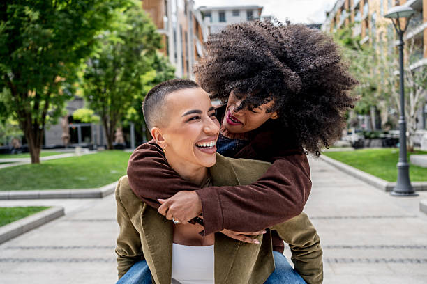 istock Joyful friends enjoying a city stroll together 2224313412