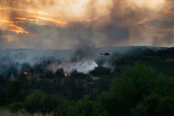 istock Helicopter dumping water on a wildfire 2224314020